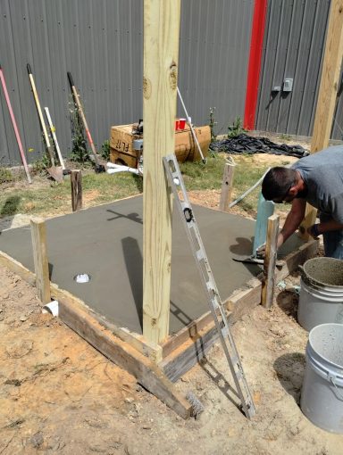 Cement slab for a water well